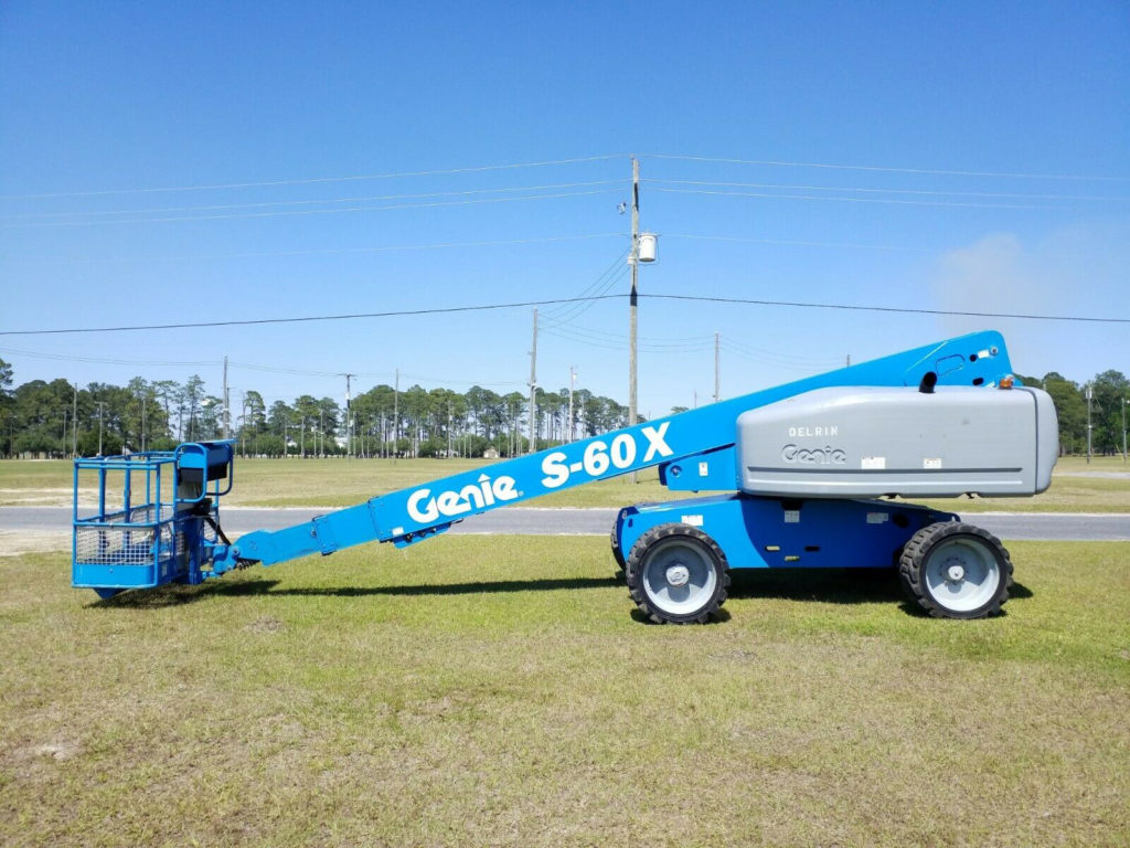 60 foot blue manlift in a field