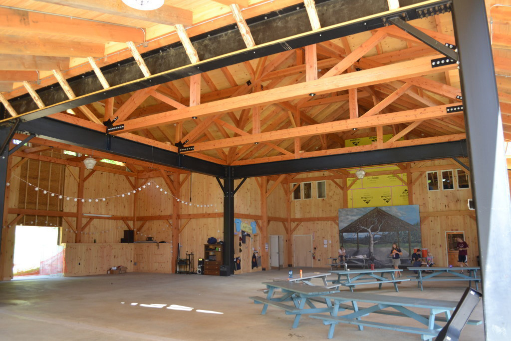 Finished interior of a timber frame summer camp pavilion