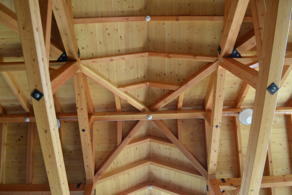 Finished interior ceiling of a timber frame summer camp pavilion
